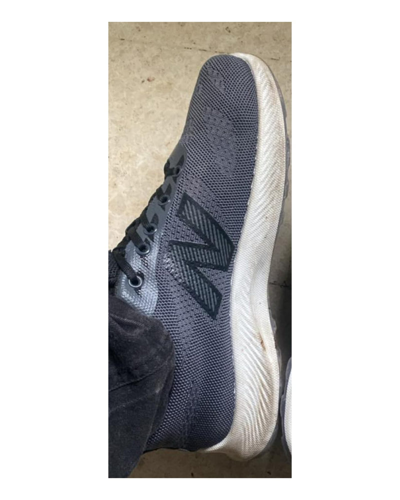 Dirty yellowed white shoe